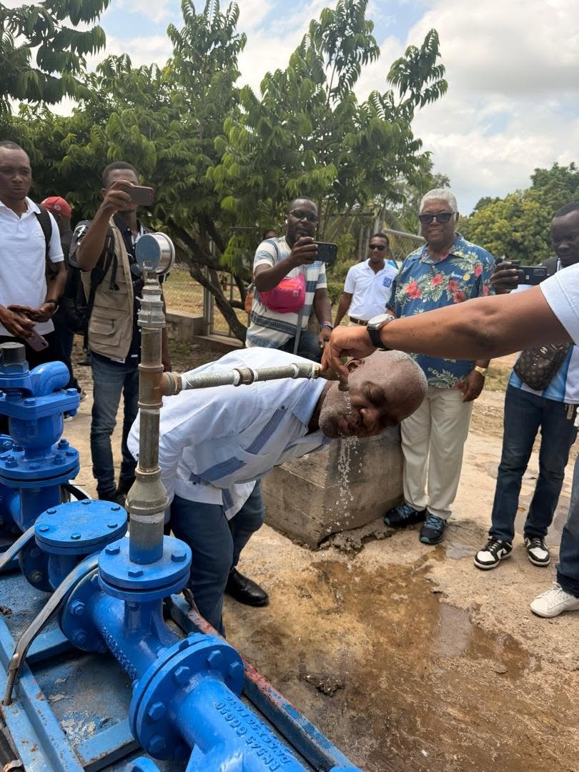 Four men reviewing the details for the Pignon Water System Service